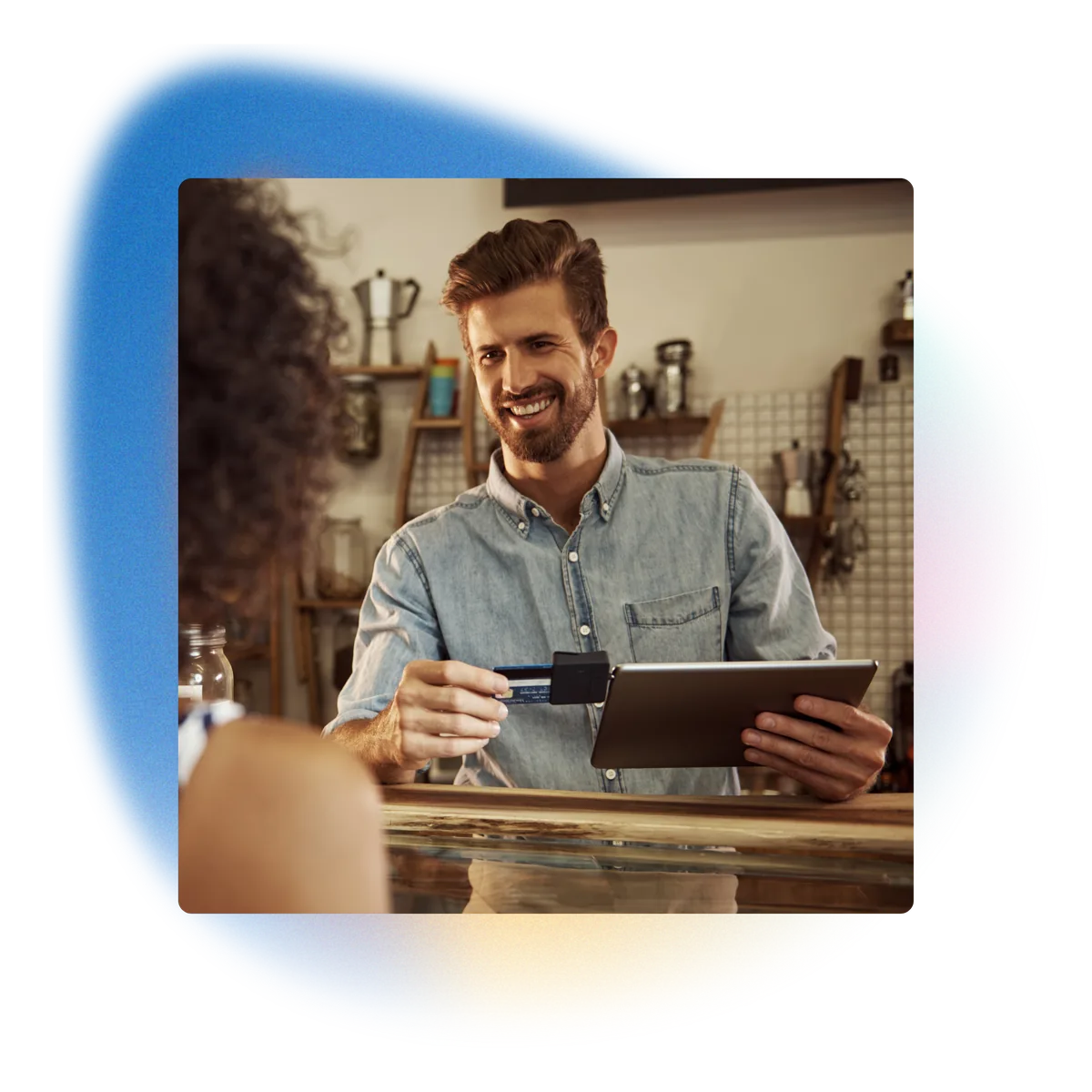 A small-business owner taking a card payment on a tablet — kept online by Connect